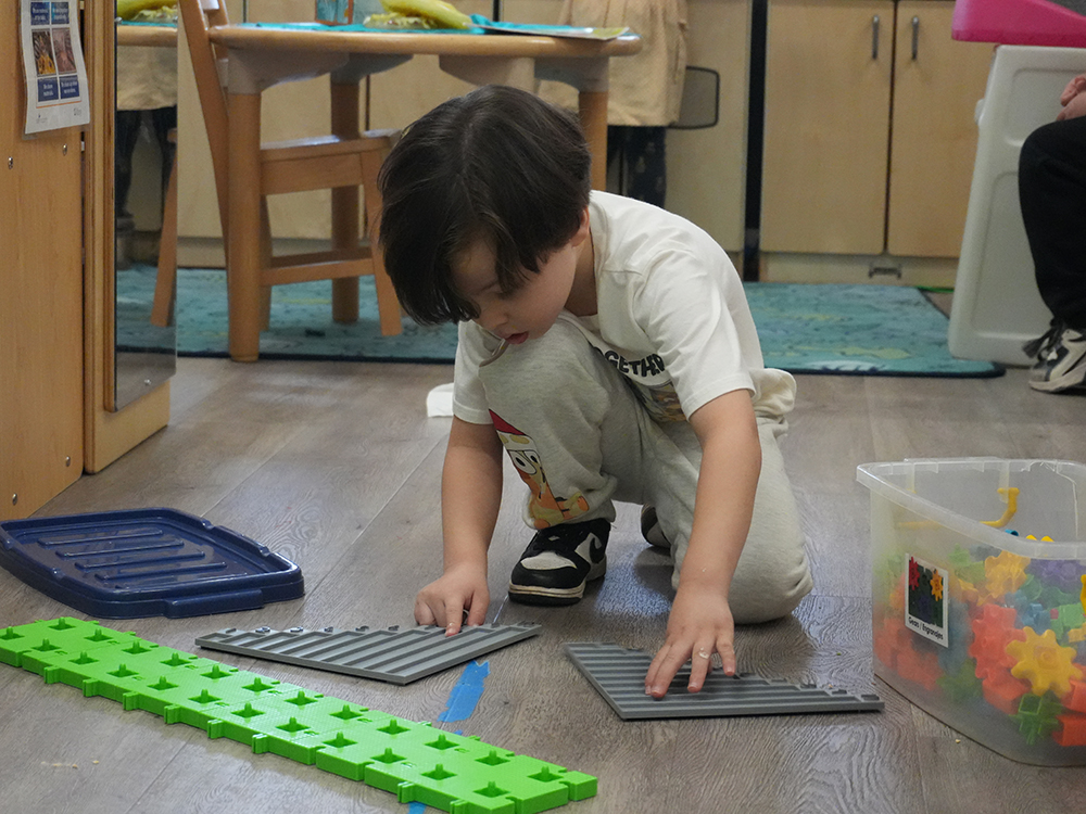 Child learning in early childhood classroom